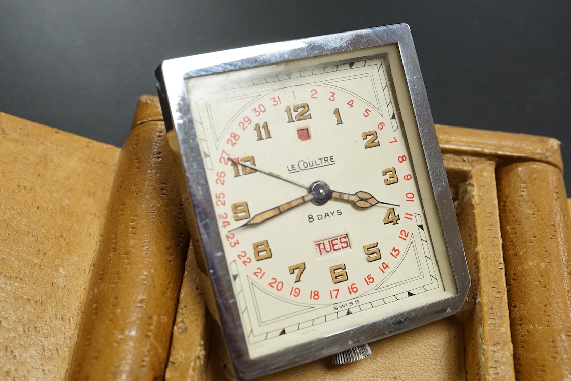 A leather cased chrome LeCoultre 8-day travelling timepiece, 9.5cm wide